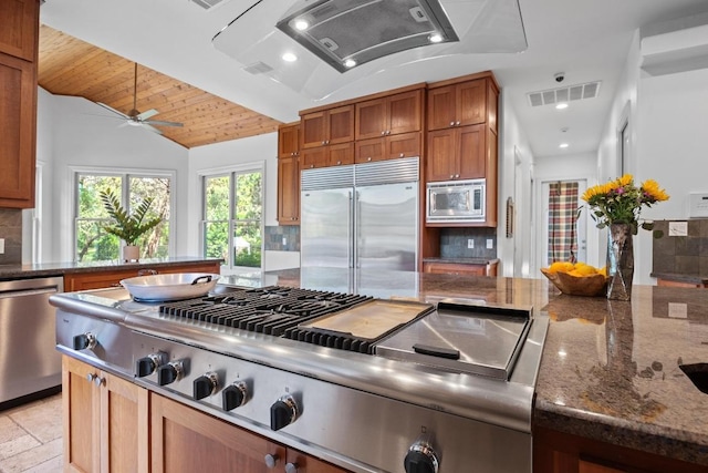 106 Sendera Bonita, Austin, TX 78734 - kitchen featuring built in appliances, backsplash, brown cabinetry, a ceiling fan, and lofted ceiling