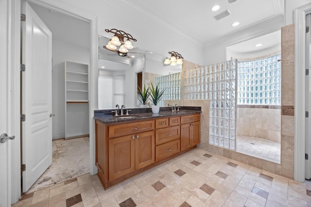 106 Sendera Bonita, Austin, TX 78734 - bathroom featuring ornamental molding, a walk in shower, double vanity, and recessed lighting