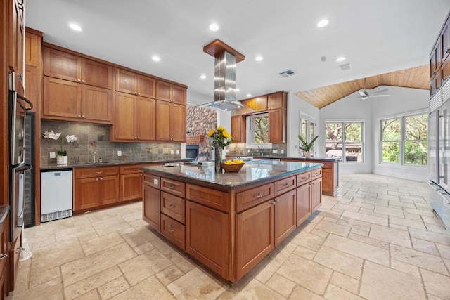 106 Sendera Bonita, Austin, TX 78734 - kitchen featuring white dishwasher, brown cabinets, recessed lighting, stone tile floors, and tasteful backsplash