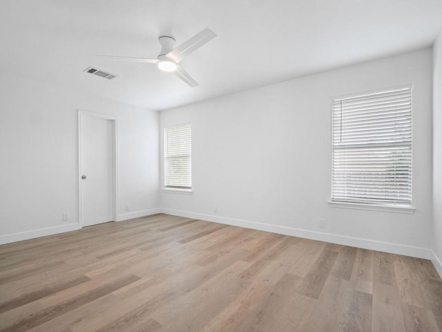109 Orange Tree Ln, Georgetown, TX 78626 - spare room with light wood-style floors, ceiling fan, and baseboards