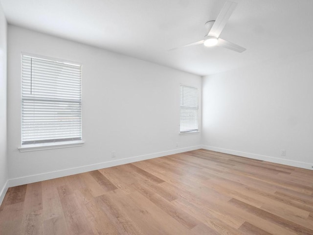 109 Orange Tree Ln, Georgetown, TX 78626 - spare room with light wood-style flooring, a ceiling fan, and baseboards
