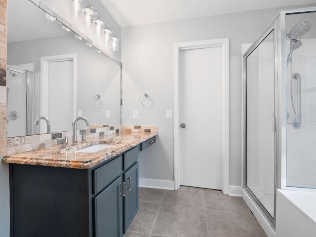 109 Orange Tree Ln, Georgetown, TX 78626 - full bathroom with a shower stall, vanity, baseboards, and tile patterned floors