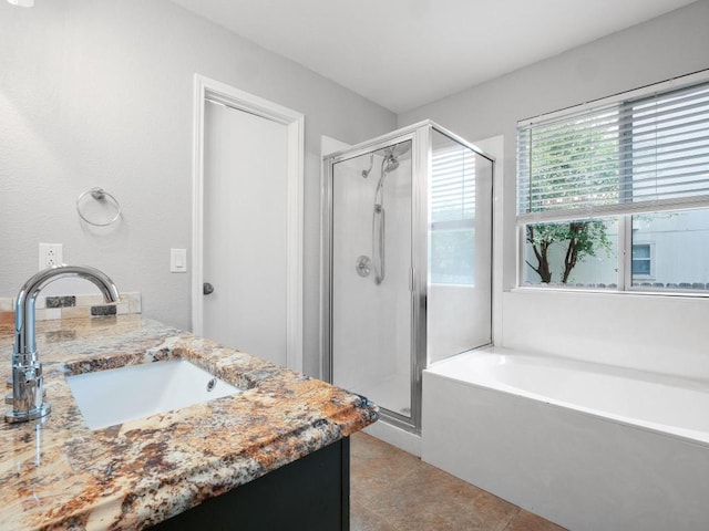 109 Orange Tree Ln, Georgetown, TX 78626 - bathroom featuring a stall shower, a garden tub, tile patterned flooring, and vanity