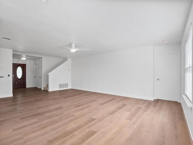 109 Orange Tree Ln, Georgetown, TX 78626 - unfurnished living room with ceiling fan, light wood-style flooring, and baseboards