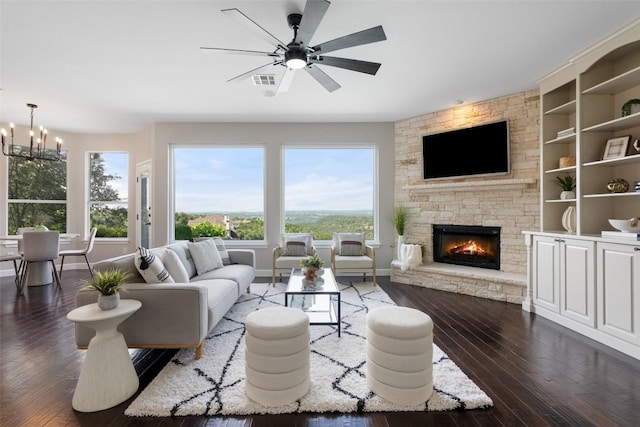 living room with a chandelier, plenty of natural light, and wood-type flooring