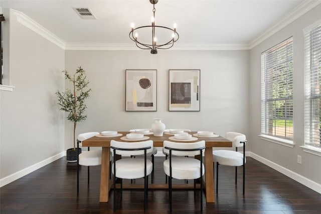 dining space with dark wood finished floors, baseboards, a chandelier, and crown molding