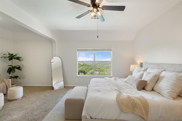 carpeted bedroom featuring baseboards, ceiling fan, and lofted ceiling