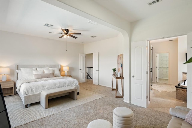 bedroom featuring light carpet, a ceiling fan, and baseboards