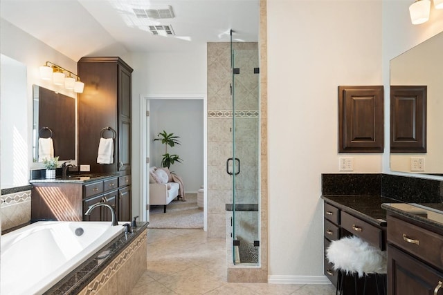 full bath featuring a shower stall, vanity, a bath, tile patterned floors, and baseboards