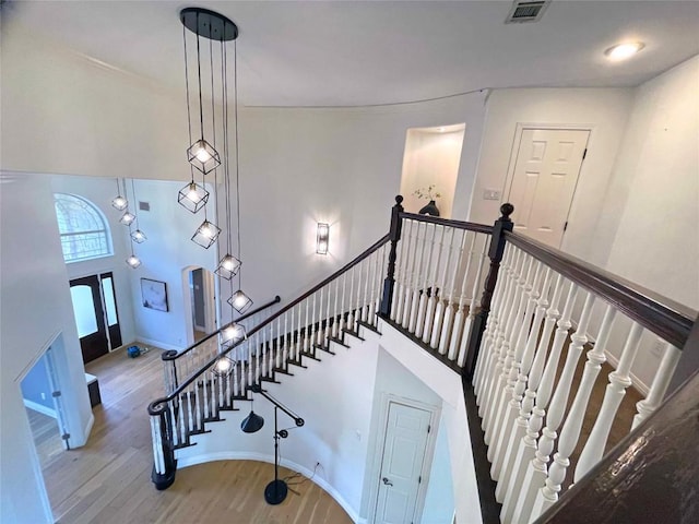 9604 Big View Dr, Austin, TX 78730 - staircase featuring wood finished floors and baseboards