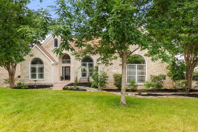 9604 Big View Dr, Austin, TX 78730 - view of front of property featuring stone siding and a front yard
