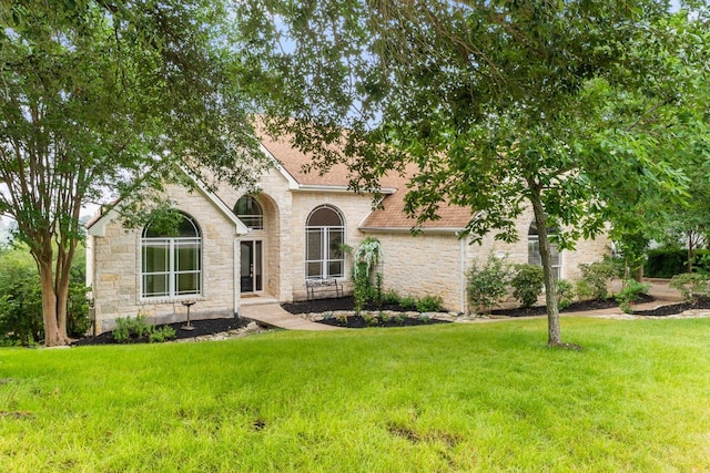 9604 Big View Dr, Austin, TX 78730 - view of front of house featuring stone siding, a front yard, and a shingled roof