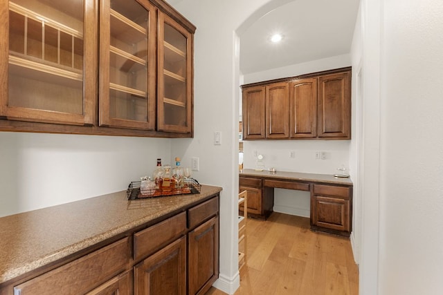 9604 Big View Dr, Austin, TX 78730 - kitchen featuring light wood-style floors, glass insert cabinets, and recessed lighting