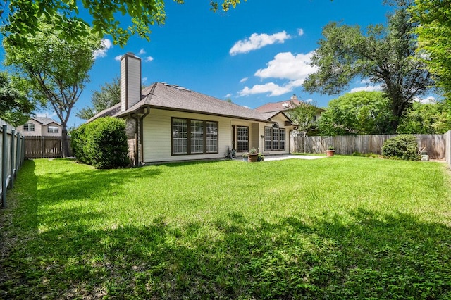 1209 Fenway Park, Pflugerville, TX 78660 - rear view of house with a chimney and a patio