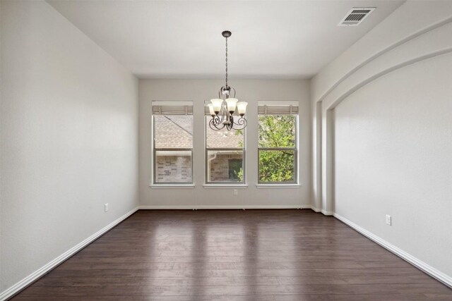 21816 Agarito Ln, Spicewood, TX 78669 - empty room with dark wood-type flooring, a chandelier, and baseboards