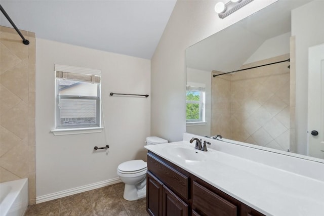 21816 Agarito Ln, Spicewood, TX 78669 - full bathroom featuring lofted ceiling, toilet, vanity, baseboards, and washtub / shower combination