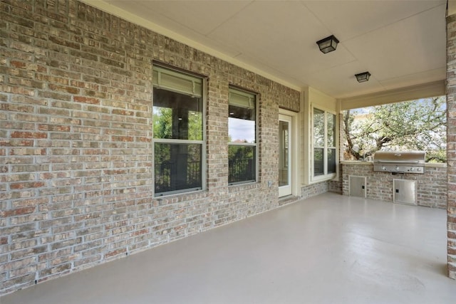 21816 Agarito Ln, Spicewood, TX 78669 - view of patio / terrace with an outdoor kitchen and grilling area