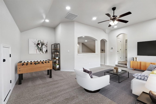 21816 Agarito Ln, Spicewood, TX 78669 - carpeted living area with arched walkways, a ceiling fan, recessed lighting, baseboards, and lofted ceiling