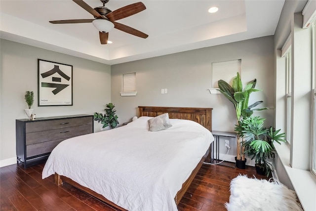 4612 Windy Brook Dr Unit A, Austin, TX 78723 - bedroom featuring a tray ceiling, hardwood / wood-style flooring, recessed lighting, baseboards, and a ceiling fan