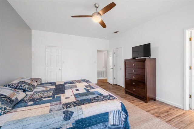 146 Long Shadow Dr, Bastrop, TX 78602 - bedroom with wood finished floors, baseboards, and a ceiling fan