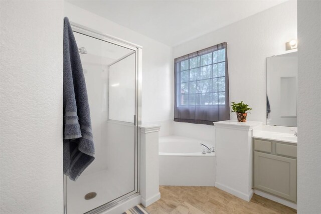 146 Long Shadow Dr, Bastrop, TX 78602 - full bathroom with a shower stall, vanity, and a garden tub