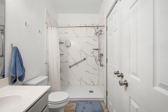 146 Long Shadow Dr, Bastrop, TX 78602 - full bath with toilet, vanity, and a marble finish shower