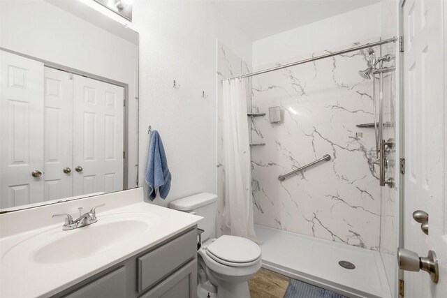 146 Long Shadow Dr, Bastrop, TX 78602 - full bathroom with vanity, toilet, and a marble finish shower