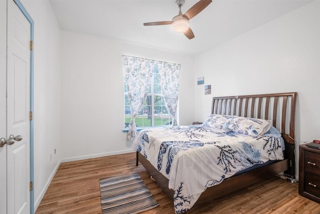 146 Long Shadow Dr, Bastrop, TX 78602 - bedroom with wood finished floors, baseboards, and a ceiling fan