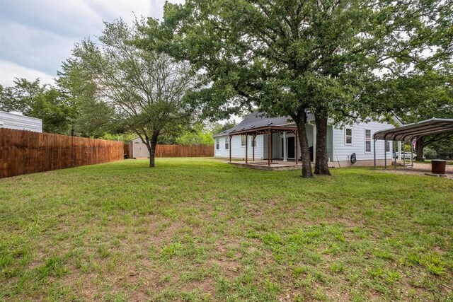 146 Long Shadow Dr, Bastrop, TX 78602 - view of yard with a carport