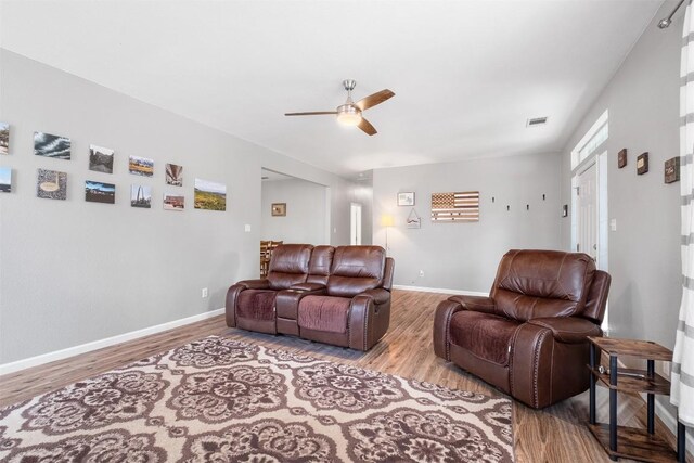 146 Long Shadow Dr, Bastrop, TX 78602 - living room featuring ceiling fan, wood finished floors, and baseboards