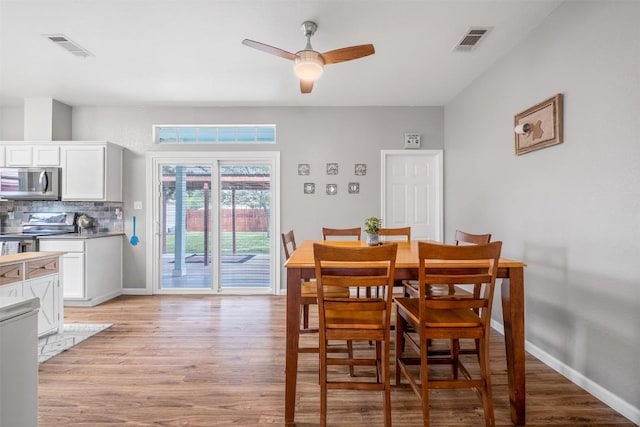 146 Long Shadow Dr, Bastrop, TX 78602 - dining room featuring light wood-style flooring, ceiling fan, and baseboards