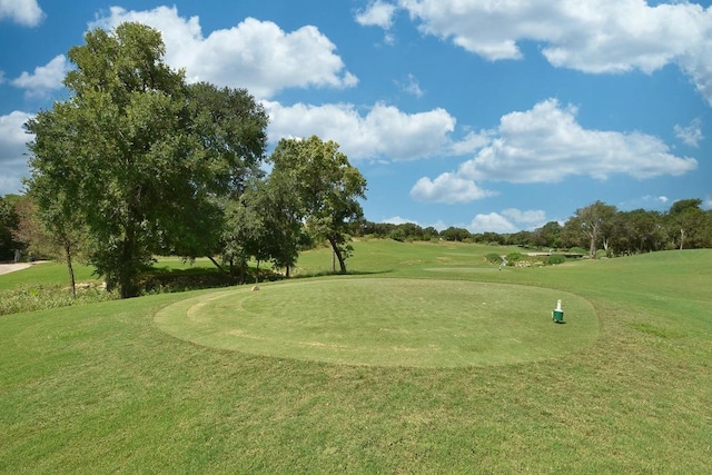 15004 Falconhead Grove Loop, Austin, TX 78738 - surrounding community featuring a lawn, golf course view, and view of scattered trees