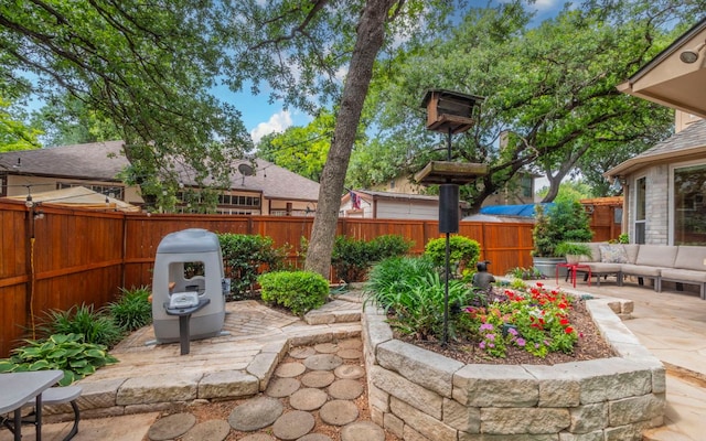 view of patio / terrace featuring an outdoor living space and a fenced backyard