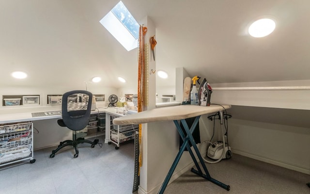 home office featuring a skylight and lofted ceiling
