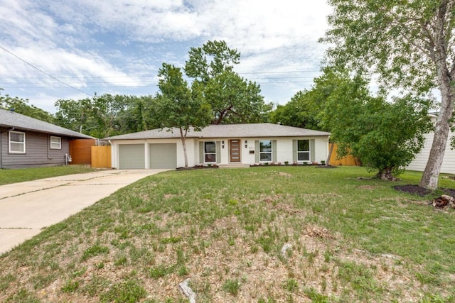 5711 Wellington Dr, Austin, TX 78723 - ranch-style house with a garage and driveway