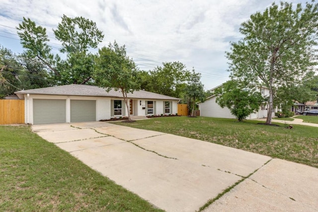 5711 Wellington Dr, Austin, TX 78723 - ranch-style house featuring a garage and concrete driveway