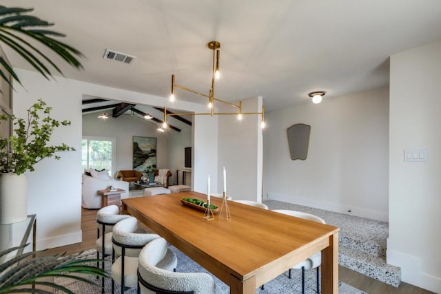5711 Wellington Dr, Austin, TX 78723 - dining room featuring a chandelier and wood finished floors