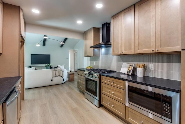 5711 Wellington Dr, Austin, TX 78723 - kitchen featuring appliances with stainless steel finishes, wall chimney exhaust hood, dark countertops, tasteful backsplash, and light wood-style floors
