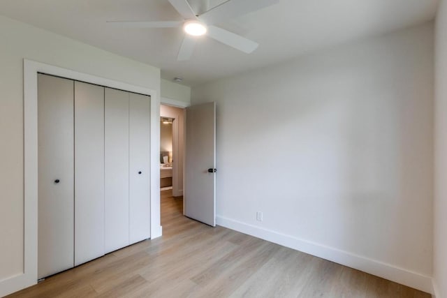 5711 Wellington Dr, Austin, TX 78723 - unfurnished bedroom featuring light wood-style floors, a closet, and a ceiling fan