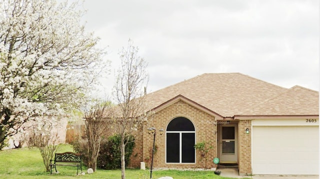 2605 Little Nolan Rd, Killeen, TX 76542 - ranch-style home featuring a shingled roof, an attached garage, a front yard, and brick siding