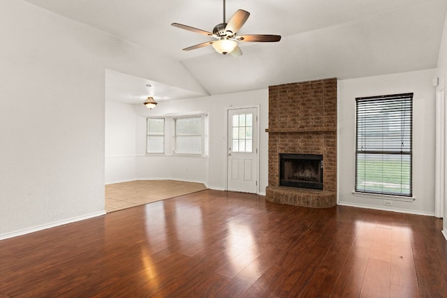 2605 Little Nolan Rd, Killeen, TX 76542 - unfurnished living room with lofted ceiling, a ceiling fan, wood finished floors, a fireplace, and baseboards
