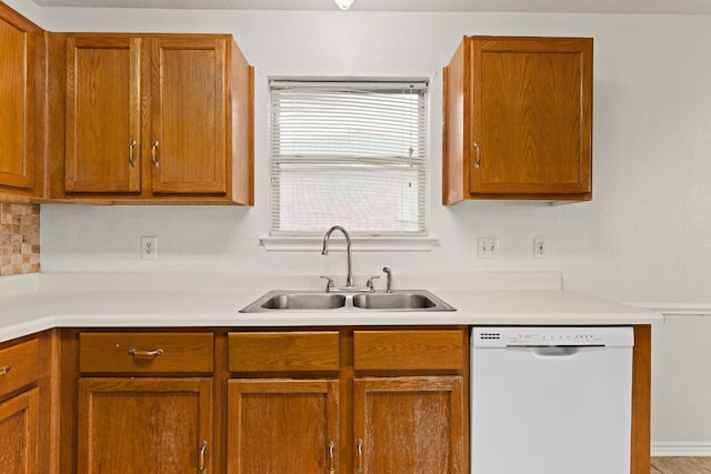 2605 Little Nolan Rd, Killeen, TX 76542 - kitchen with white dishwasher, a sink, light countertops, and brown cabinets