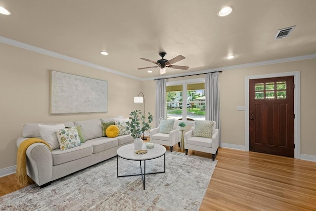 3214 Funston St, Austin, TX 78703 - living room with recessed lighting, light wood finished floors, crown molding, plenty of natural light, and ceiling fan