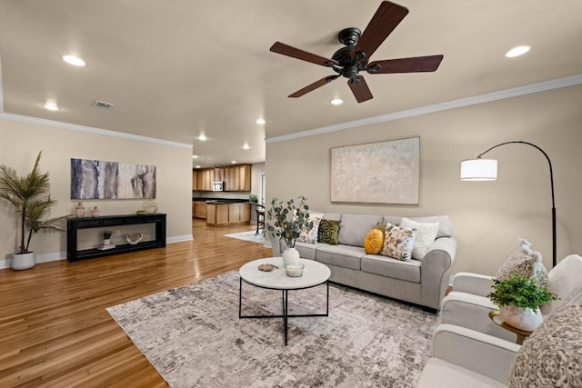 3214 Funston St, Austin, TX 78703 - living area featuring recessed lighting, ceiling fan, ornamental molding, and light wood-style flooring