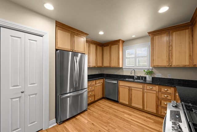 3214 Funston St, Austin, TX 78703 - kitchen with appliances with stainless steel finishes, light wood-type flooring, recessed lighting, and dark stone countertops
