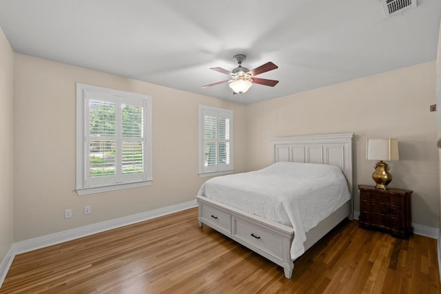3214 Funston St, Austin, TX 78703 - bedroom featuring wood finished floors and a ceiling fan