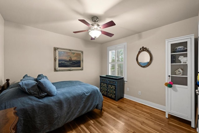3214 Funston St, Austin, TX 78703 - bedroom featuring wood finished floors and ceiling fan