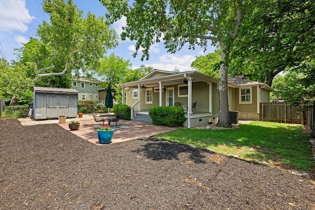 3214 Funston St, Austin, TX 78703 - rear view of property with a storage shed, a porch, a patio, and crawl space