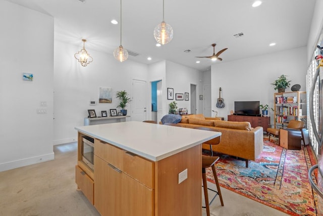 4801 Louis Ave Unit 1, Austin, TX 78721 - kitchen featuring modern cabinets, a center island, a kitchen breakfast bar, recessed lighting, and ceiling fan