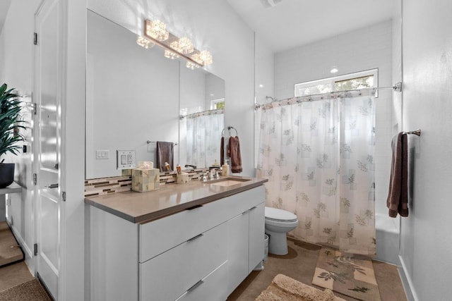 4801 Louis Ave Unit 1, Austin, TX 78721 - bathroom featuring toilet, vanity, shower / tub combo with curtain, and backsplash